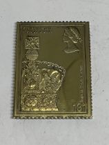 A SILVER GILT 13P STAMP INGOT