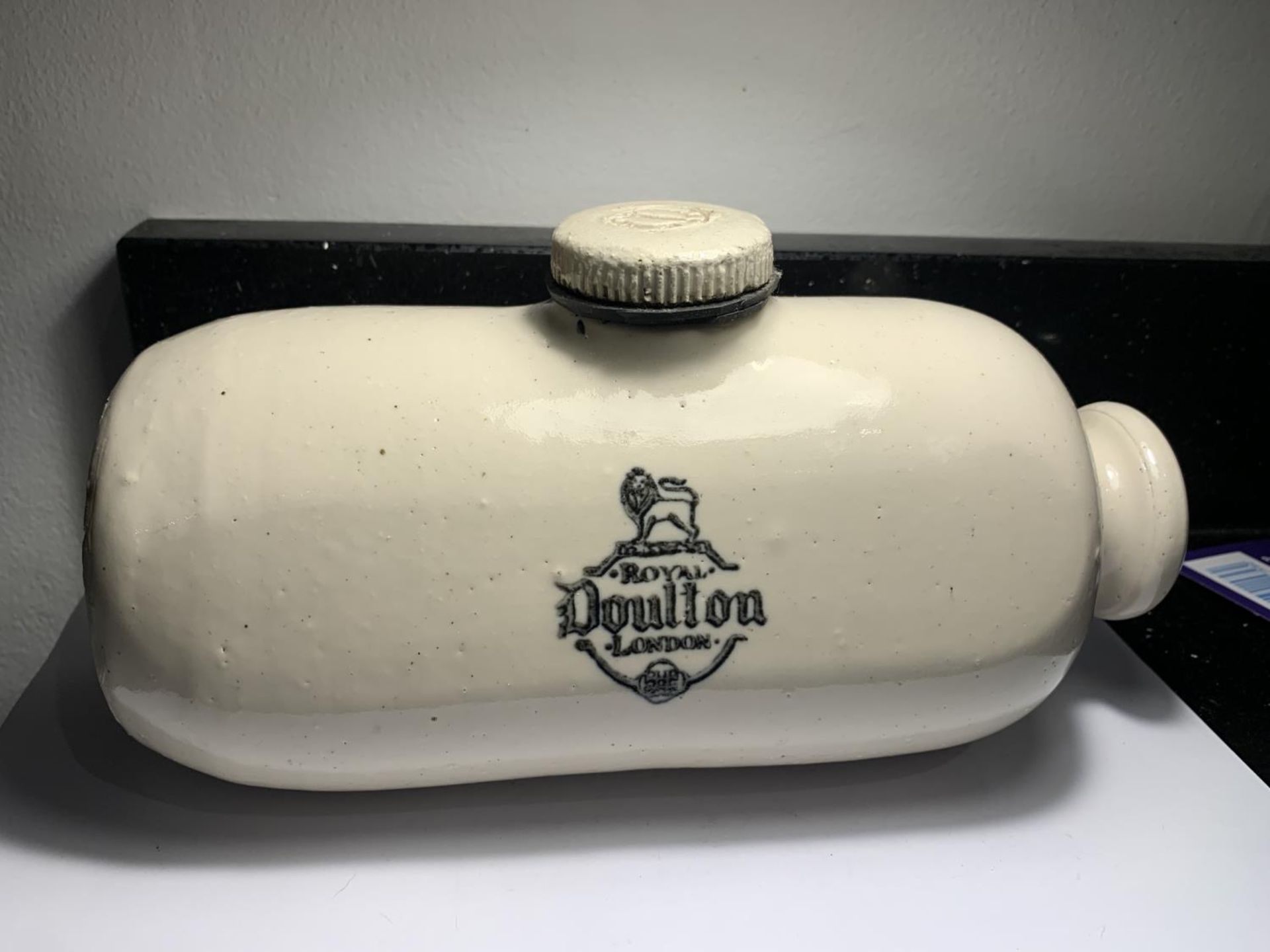 A DOULTON STONEWARE HOT WATER BOTTLE