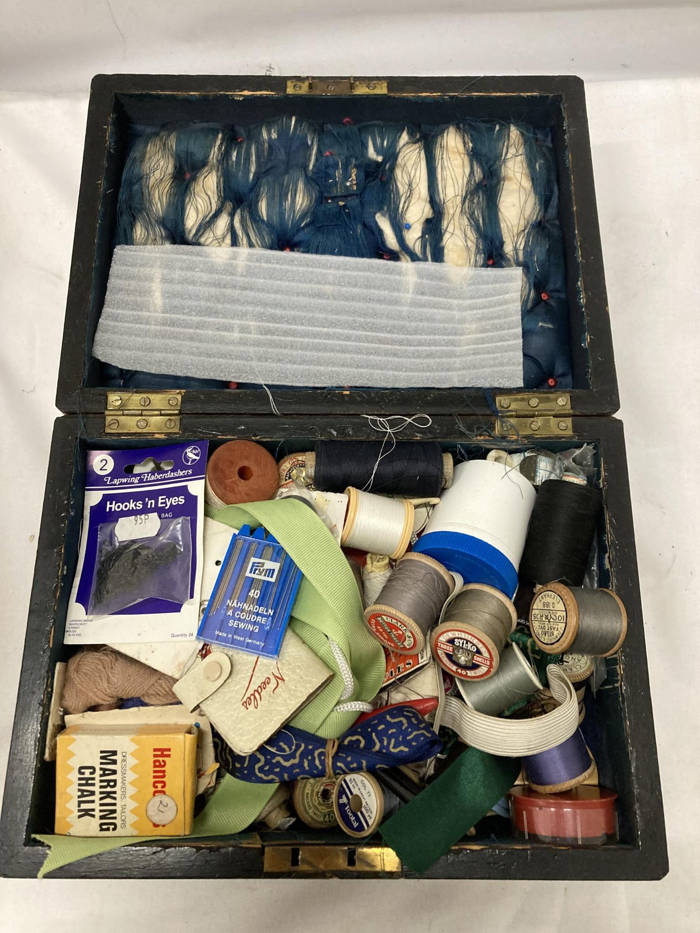 A VINTAGE MAHOGANY BOX OF ASSORTED SEWING EQUIPMENT, THREAD