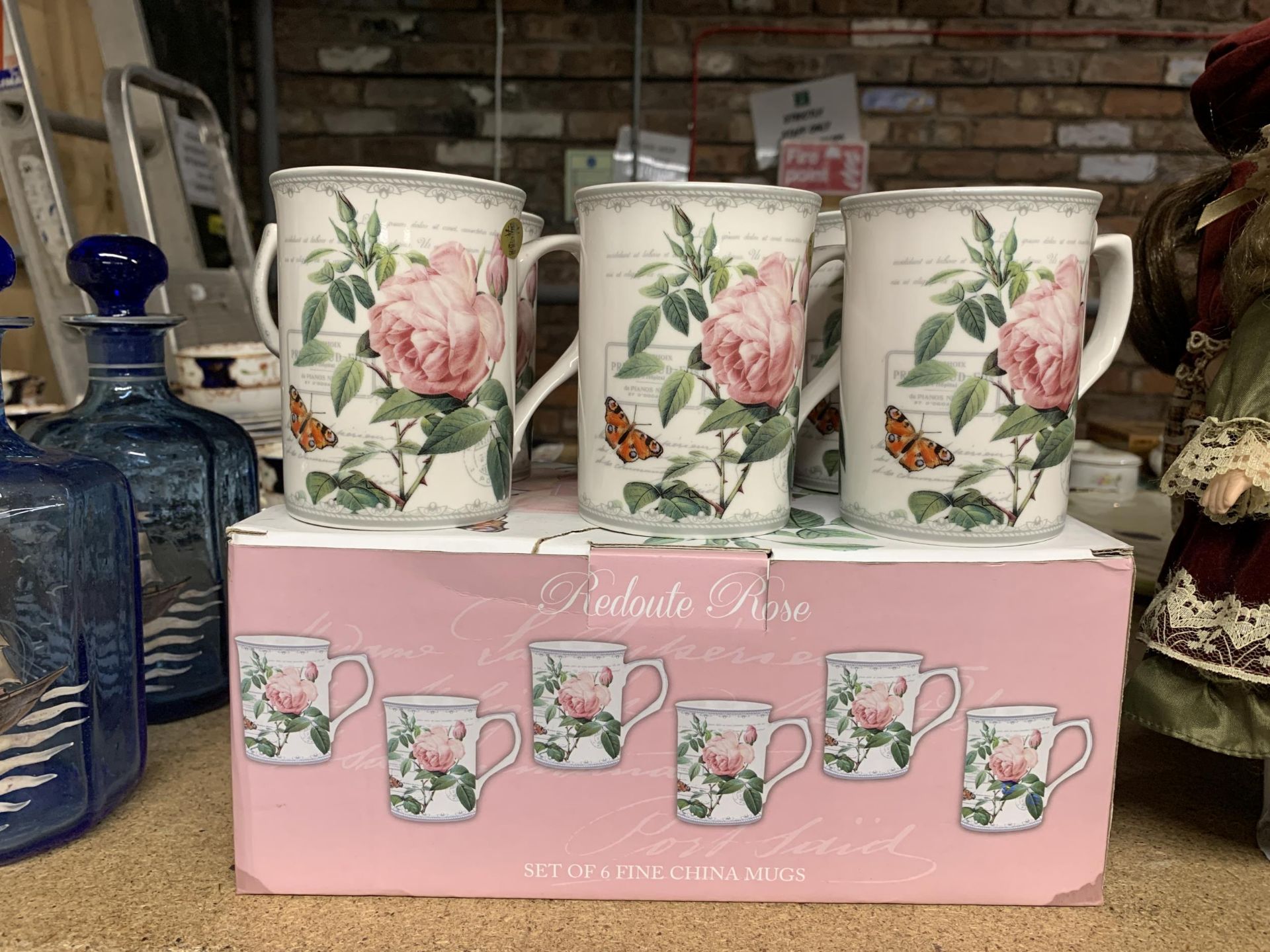 A BOXED SET OF SIX REDOUTE ROSE FINE CHINA MUGS