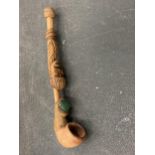 A VINTAGE HANDMADE TRIBAL WOODEN PIPE
