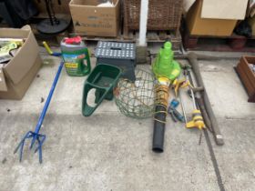 AN ASSORTMENT OF GARDEN TOOLS TO INCLUDE A SEED SOWER, AN ELECTRIC LEAF BLOWER AND A PICK AXE ETC