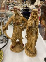 TWO VERY HEAVY SHEIKH AND ARAB LADY FIGURES, HEIGHT 31CM