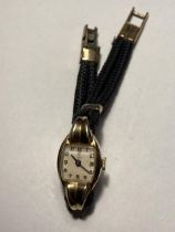 A LADIES VINTAGE 9 CARAT GOLD CASED TUDOR WRIST WATCH