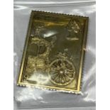 A SILVER GILT 9P STAMP INGOT