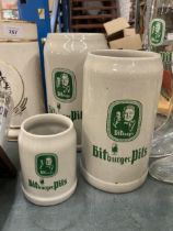 THREE LARGE STONEWARE BITBURGER STEINS, TALLEST 26CM