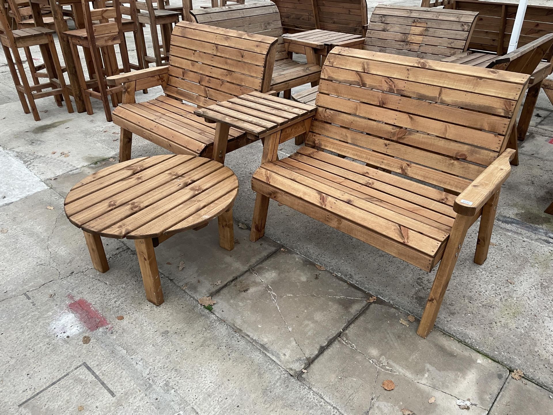 AN AS NEW EX DISPLAY CHARLES TAYLOR PATIO SET COMPRISING OF TWO TWO SEATER BENCHES, A COFFEE TABLE