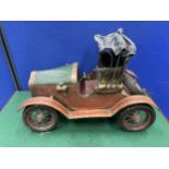 A VINTAGE FRENCH METAL MODEL CAR 19 INCHES LONG