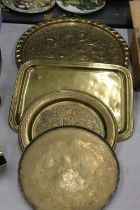 FOUR VINTAGE BRASS TRAYS