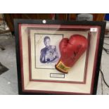 A FRAMED & SIGNED SUGAR SHANE MOSLEY BOXING GLOVE & PHOTOGRAPH