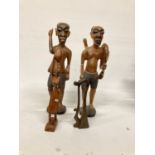 TWO LARGE TRIBAL STYLE FIGURES PLUS TWO SMALLER ONES