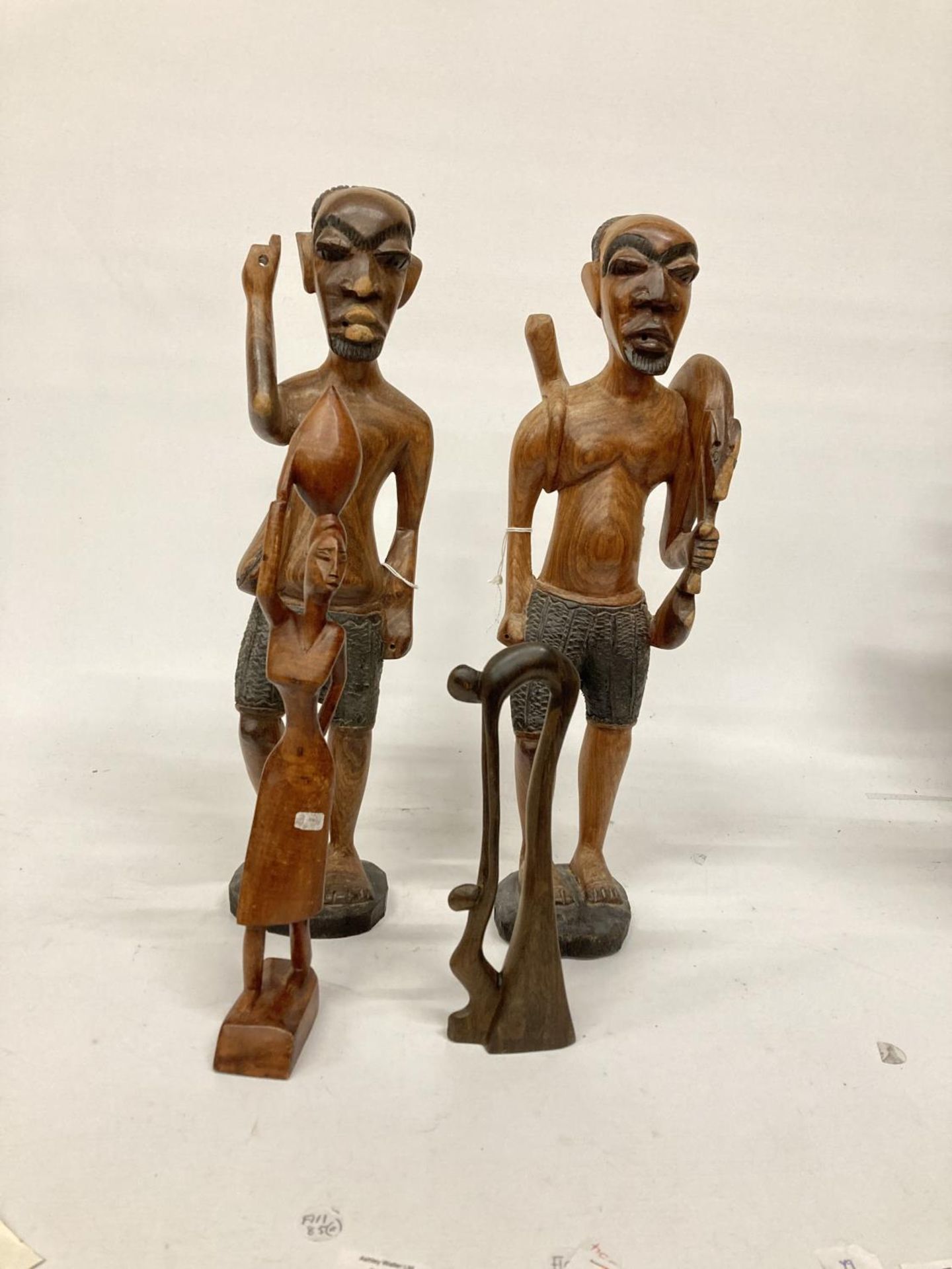 TWO LARGE TRIBAL STYLE FIGURES PLUS TWO SMALLER ONES