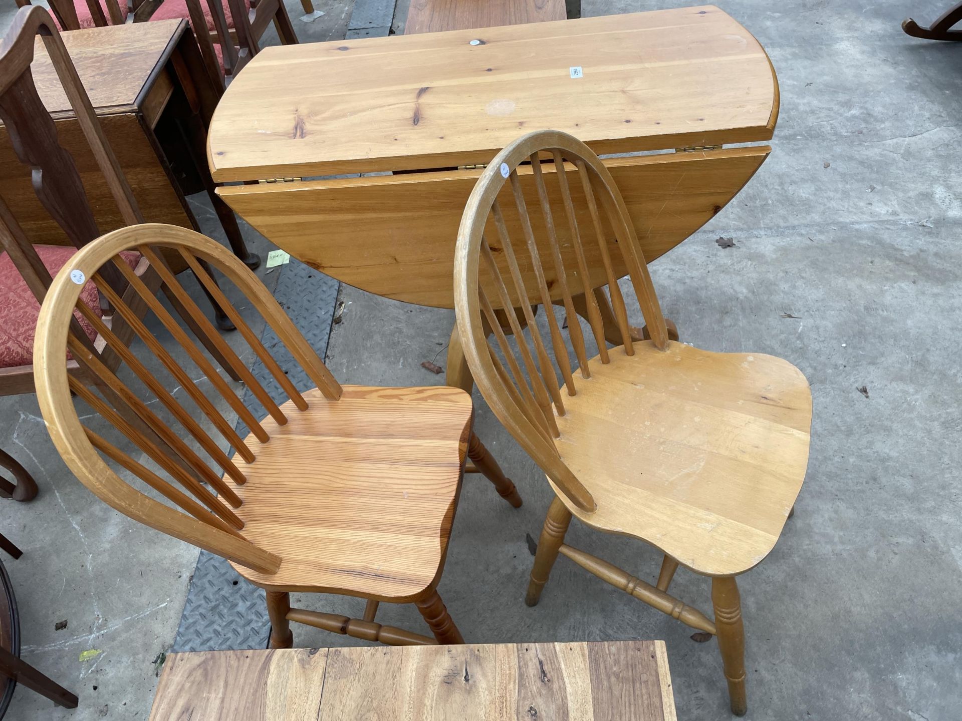 A PINE 42" DIAMETER DROP-LEAF DINING TABLE ON TRIPOD BASE AND A PAIR OF WINDSOR STYLE CHAIRS - Image 2 of 3