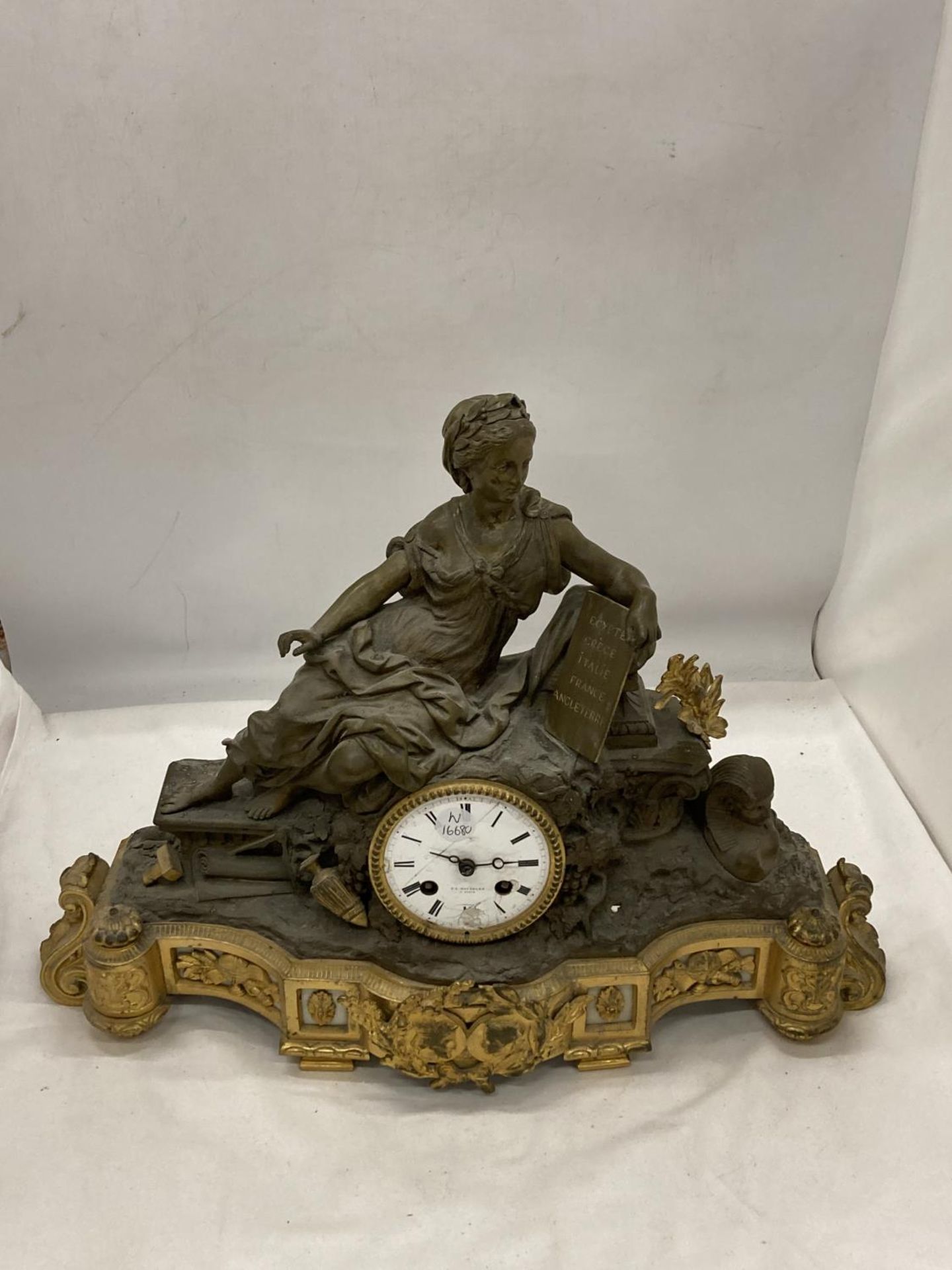 AN ORNATE FRENCH MANTLE CLOCK BY V L HAUSBERG PARIS WITH A LADY HOLDING LIST OF COUNTIRES - EGYPT,