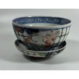 A 19TH CENTURY JAPANESE IMARI DRAGON BOWL AND MATCHING SAUCER, BOTH WITH MATCHING MOTIFS AND DESIGN,