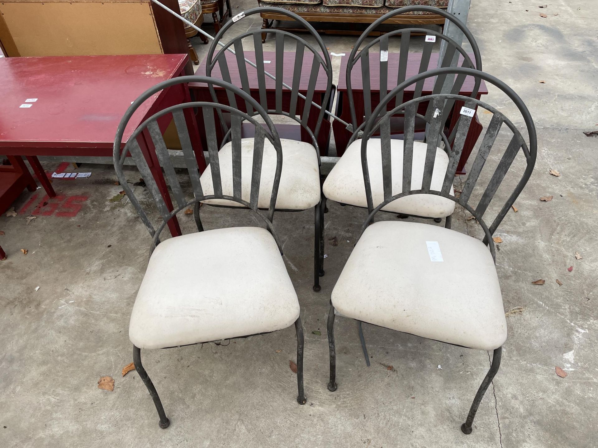 A SET OF FOUR MODERN METAL FRAMED DINING CHAIRS WITH UPHOLSTERED SEATS