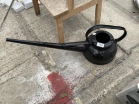 A VINTAGE LONG SPOUTED WATERING CAN
