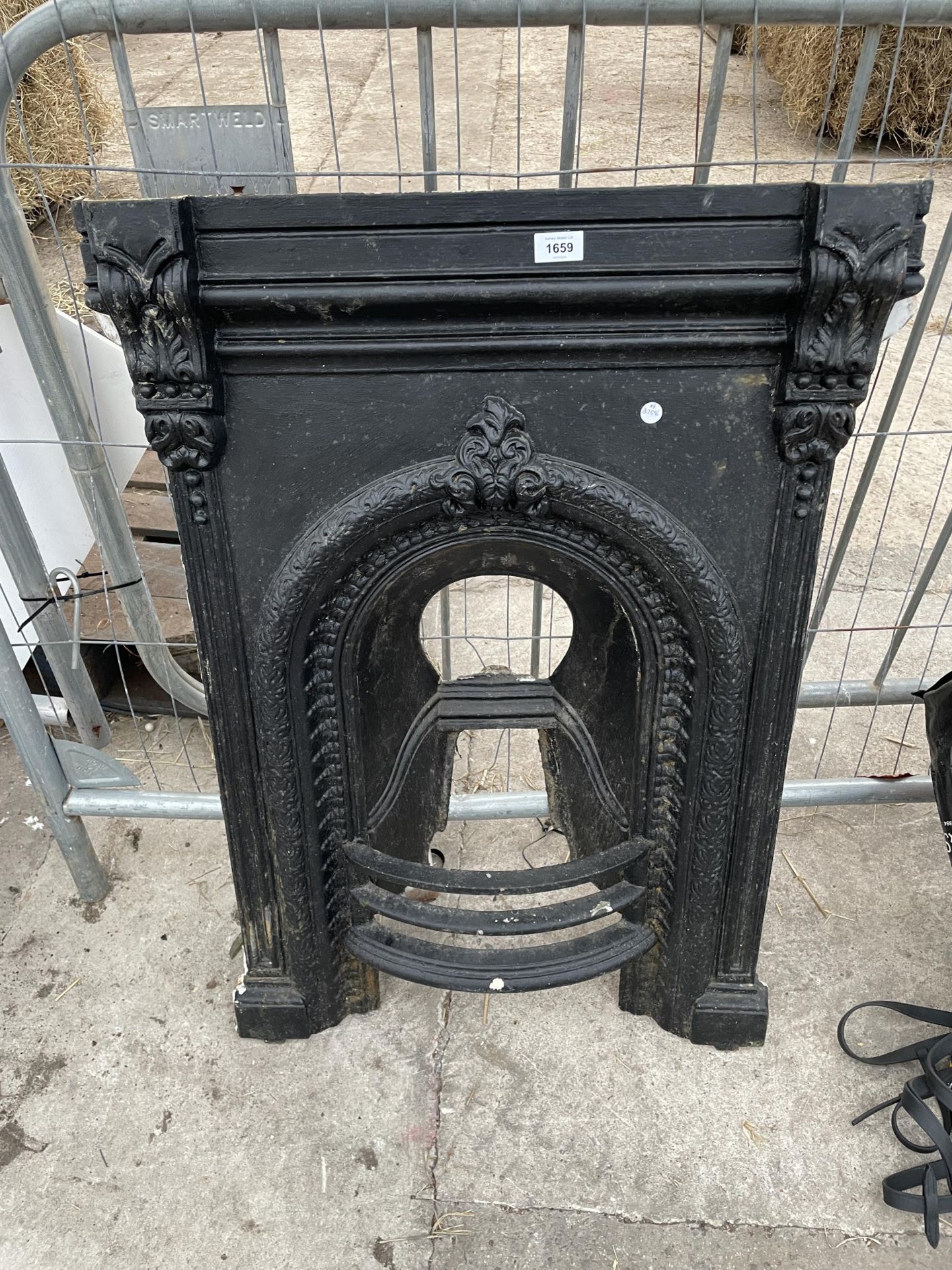 A DECORATIVE CAST IRON FIRE PLACE