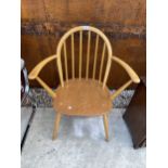 AN ERCOL BLONDE CARVER CHAIR