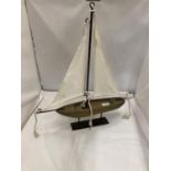 A VINTAGE WOODEN SAILING BOAT ON A DISPLAY PLINT, HEIGHT 56CM, LENGTH 46CM