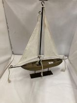 A VINTAGE WOODEN SAILING BOAT ON A DISPLAY PLINT, HEIGHT 56CM, LENGTH 46CM
