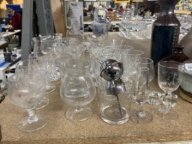 A QUANTITY OF GLASSWARE TO INCLUDE DRINKING GLASSES, VASES, ETC.,