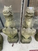 A PAIR OF CIONCRETE GARDEN DRAGON FIGURES