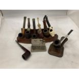 EIGHT VINTAGE PIPES WITH STANDS AND A TABLE LIGHTER