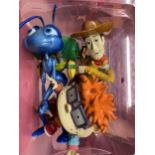 THREE FIGURES TO INCLUDE A BUG'S LIFE, WOODY FROM TOY STORY AND RUGRATS