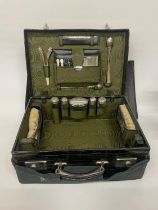 AN EDWARDIAN CROCODILE SKIN LADIES TRAVEL CASE WITH FABRIC PROTECTION COVER CONTAINING ORIGINAL