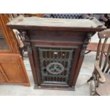 A VICTORIAN GOTHIC OAK CABINET WITH COLOURED GLASS AND LEADED DOOR, 38" WIDE