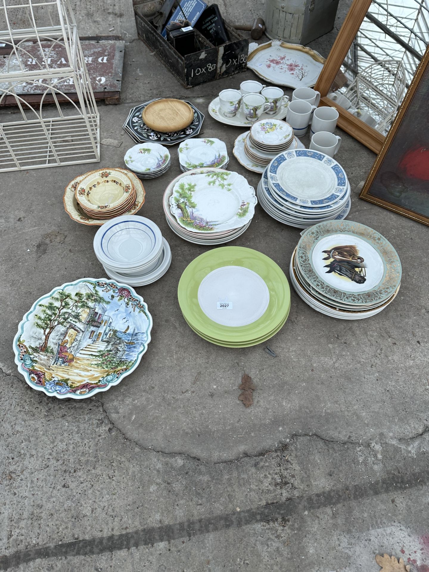 A LARGE ASSORTMENT OF CERAMICS TO INCLUDE PLATES AND CUPS ETC