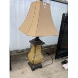 A DECORATIVE TABLE LAMP WITH SHADE