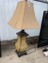 A DECORATIVE TABLE LAMP WITH SHADE