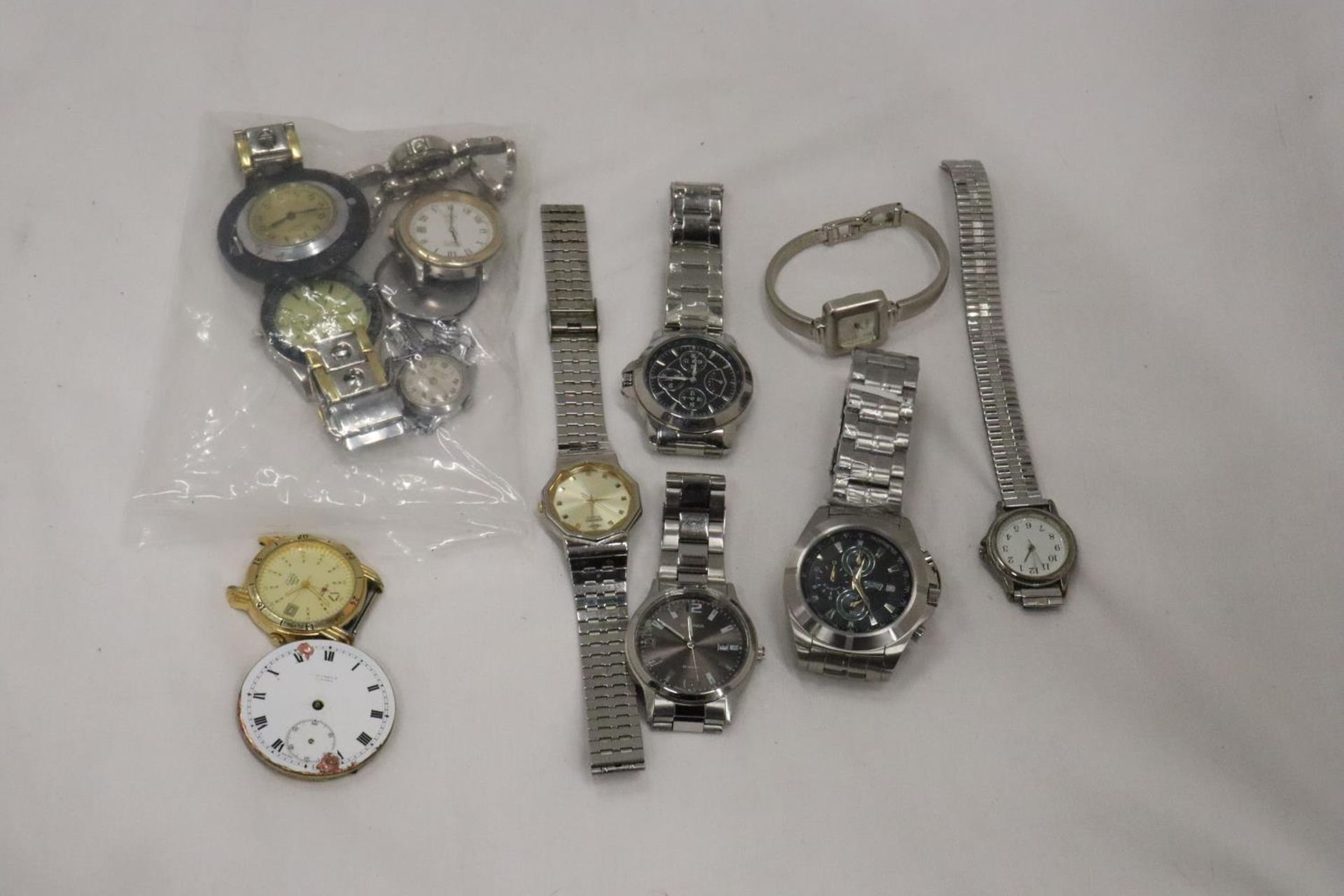 A BAG OF WRISTWATCH SPARES FOR REPAIRS