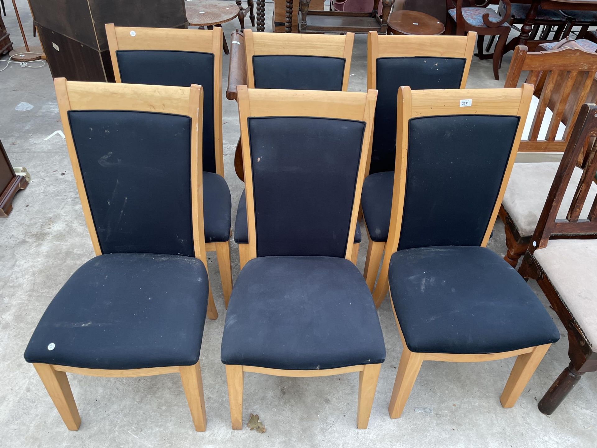 A SET OF SIX MODERN HIGH BACK DINING CHAIRS