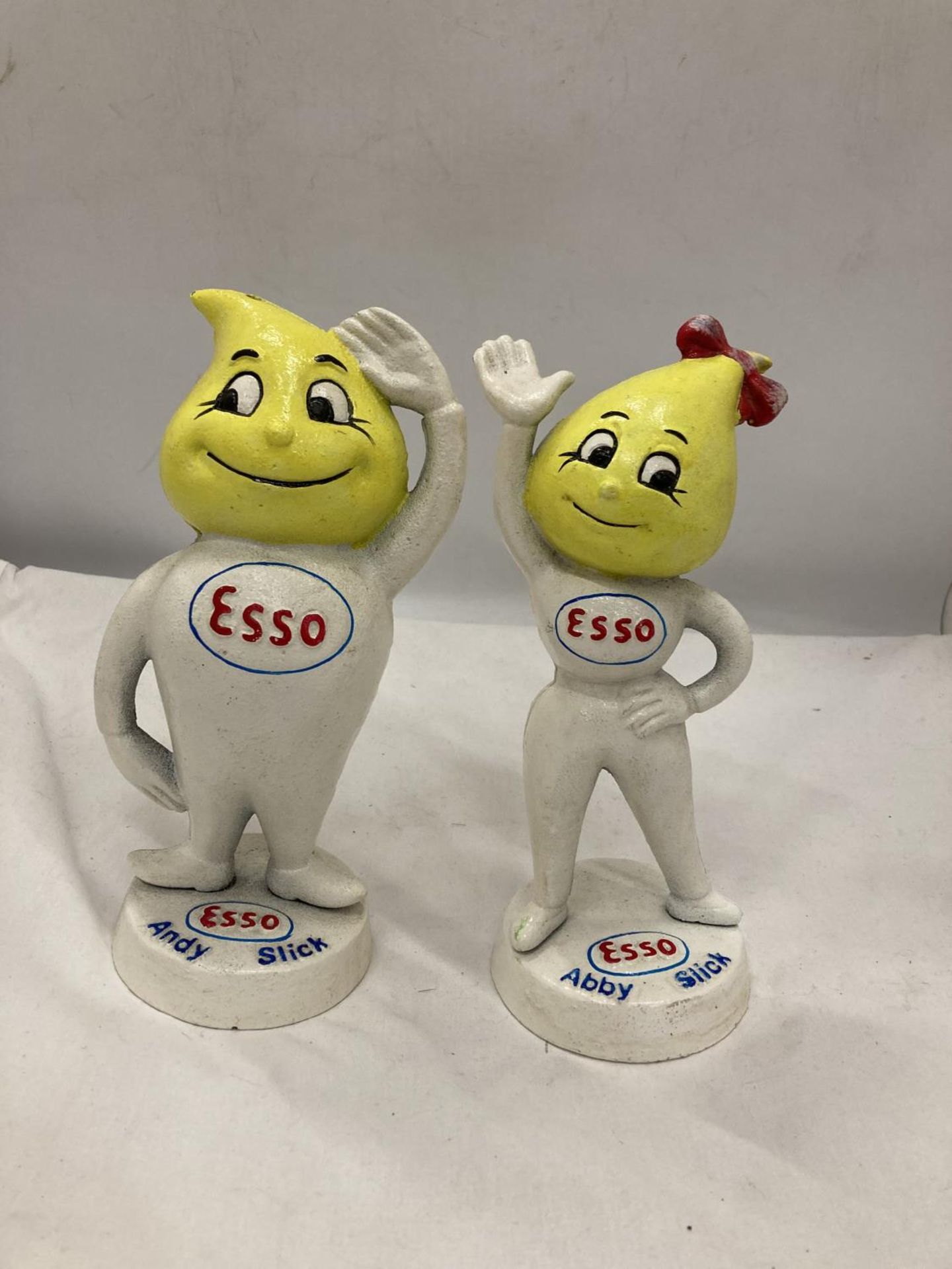 A PAIR OF CAST ESSO MR AND MRS DRIP FIGURES, HEIGHT 24CM