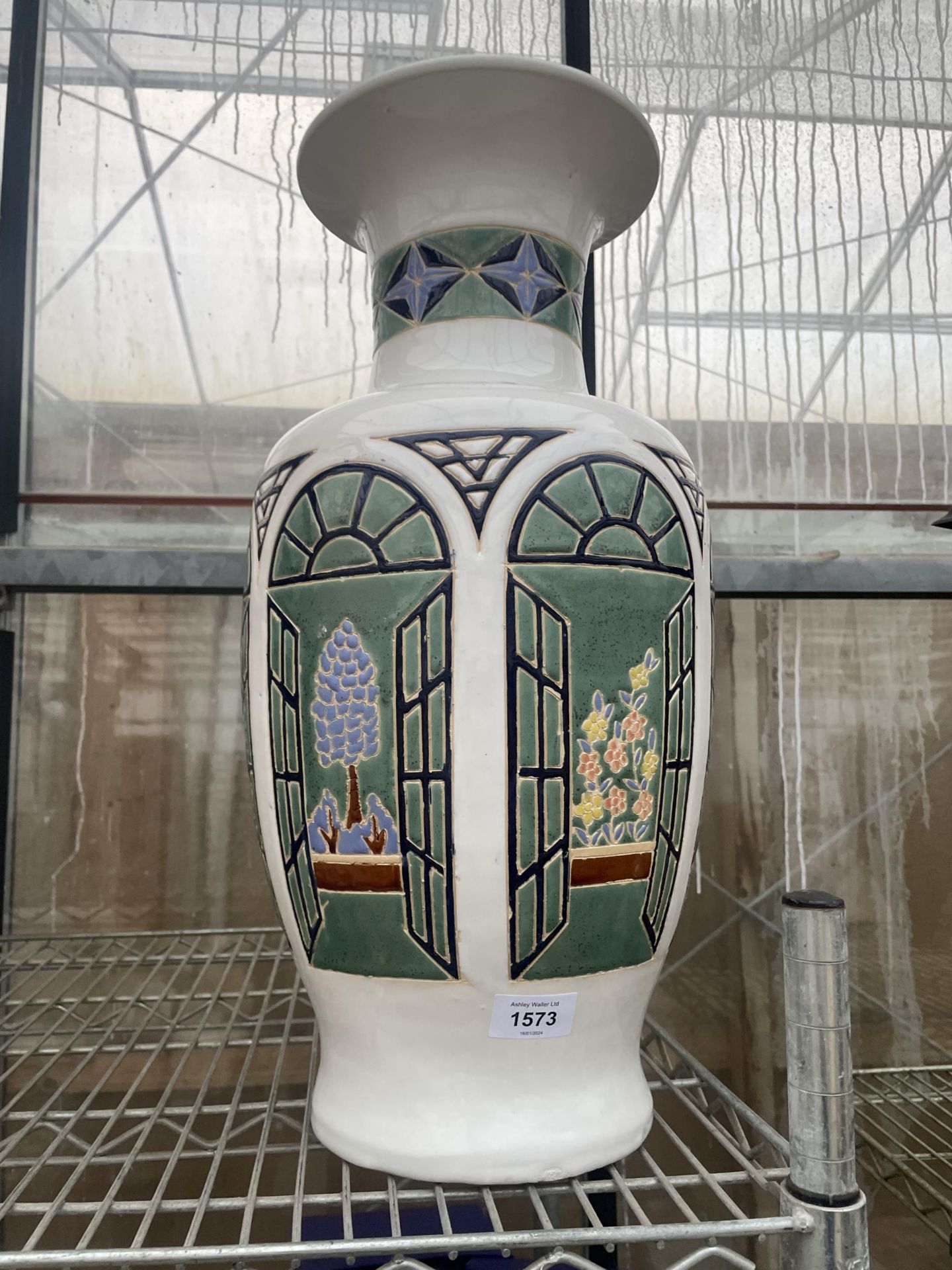 A LARGE CERAMIC STICK STAND/VASE WITH FLIOWER DECORATION