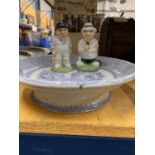 THREE ITEMS TO INCLUDE HP CRICKETER CONIMENTS AND A VINTAGE BLUE AND WHITE FOOTED PLATE