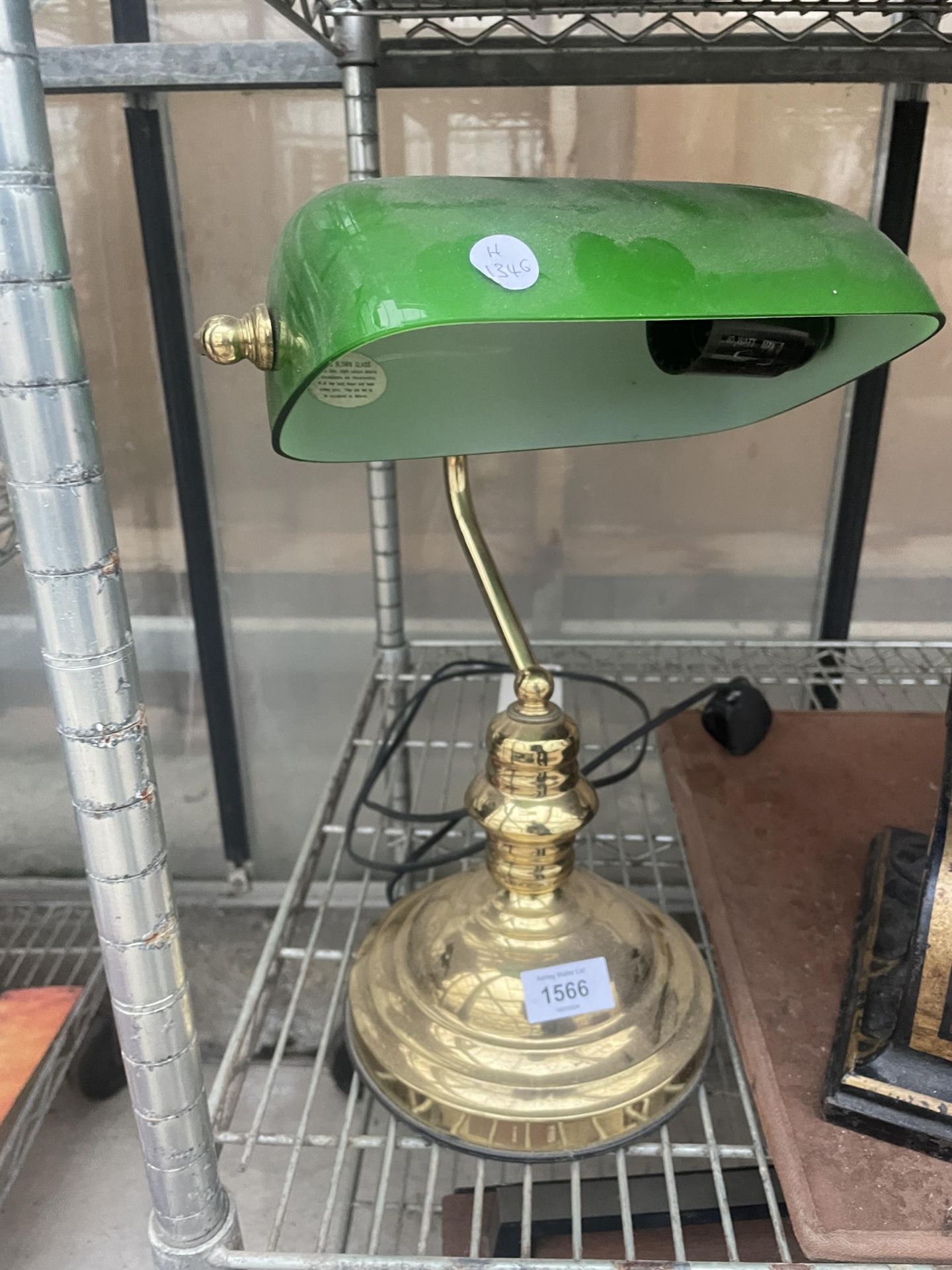 A VINTAGE BRASS BANKERS LAMP WITH GREEN GLASS SHADE