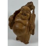 A VINTAGE CARVED WOODEN MODEL OF A BUDDHA, HEIGHT 14 CM