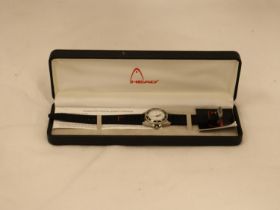 A BOXED HEAD SPORTS WATCH