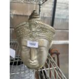 A DECORATIVE PAINTED RECONSTITUTED STONE BUDDAH HEAD