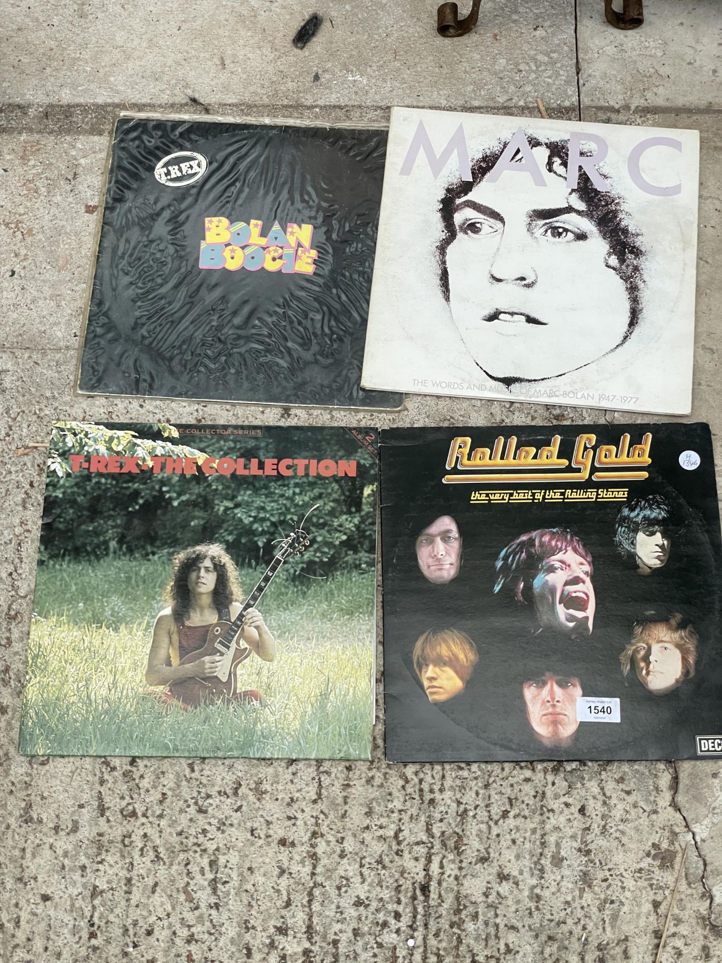 FOUR VARIOUS VINYL RECORDS TO INCLUDE T-REX AND THE ROLLING STONES