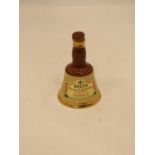 A SMALL BELL'S CERAMIC WHISKY DECANTER, HEIGHT 10CM