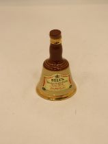 A SMALL BELL'S CERAMIC WHISKY DECANTER, HEIGHT 10CM