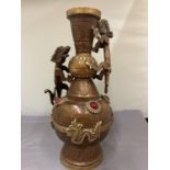 A CHINESE BRASS AND COPPER DOUBLE DRAGON HANDLED VASE/URN
