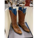 A PAIR OF COWBOY BOOTS WITH INSERTS
