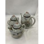 AN ORIENTAL TEAPOT, CREAM JUG AND SUGAR BOWL