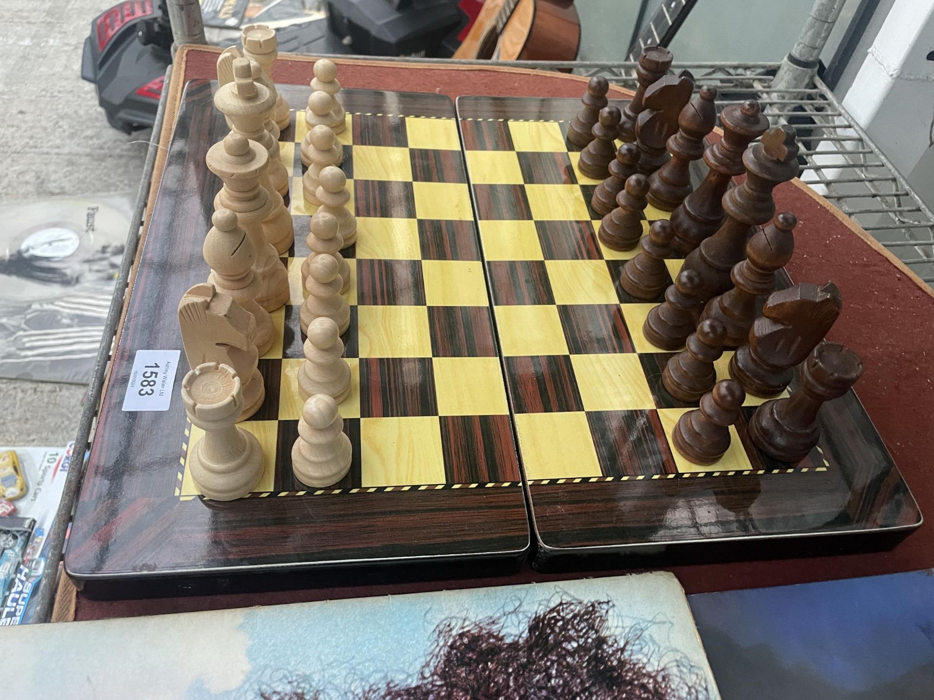 A FOLDING CHESS BOARD WITH A FULL SET OF CHESS PIECES - Image 2 of 3